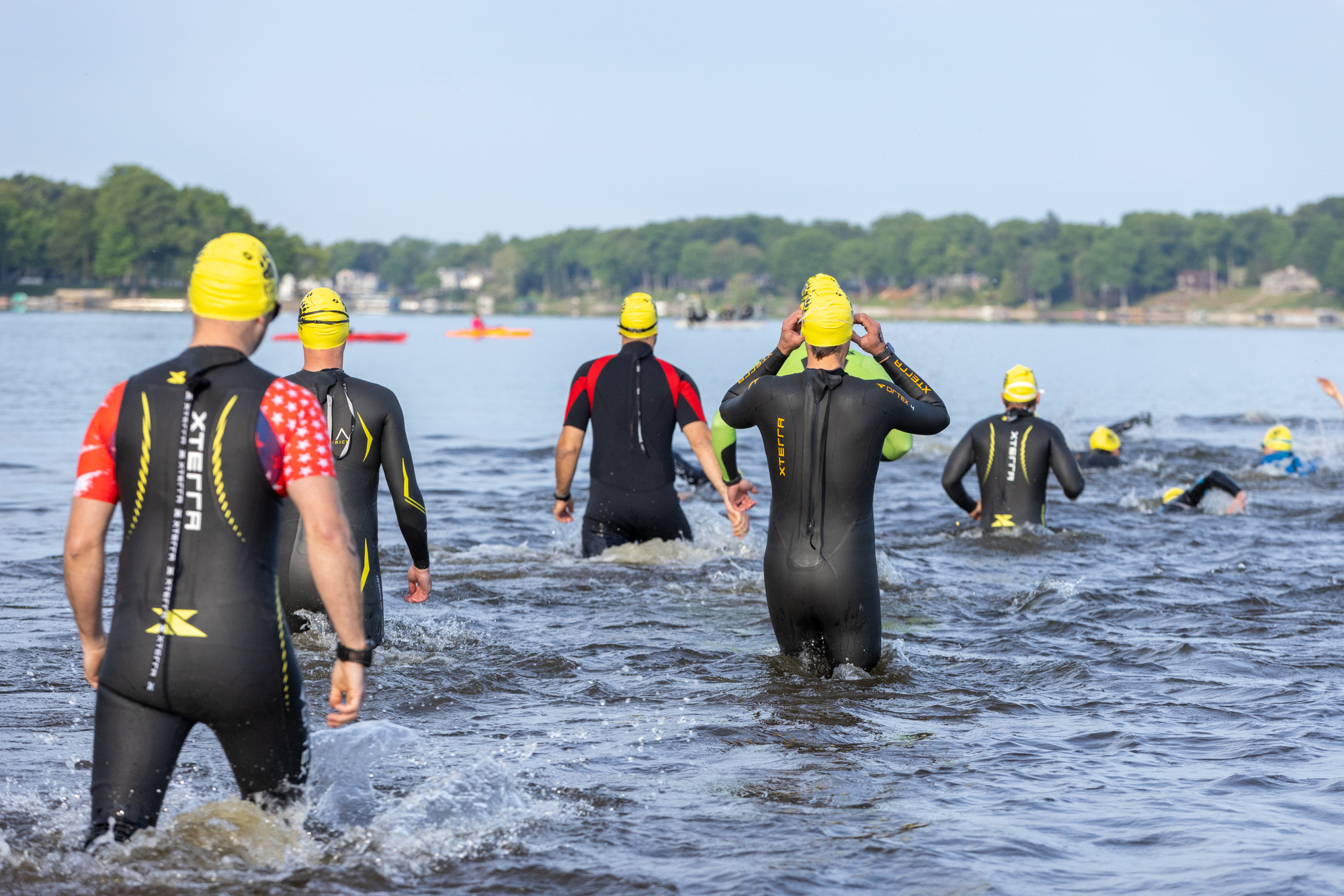 Athletes entering Bear Lake for the swim